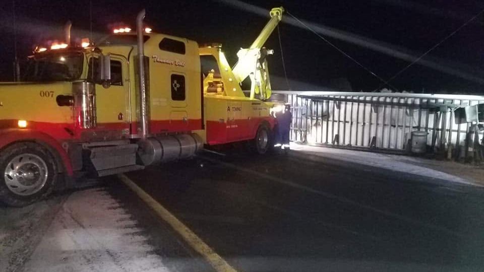 A&A Towing heavy-duty wrecker on a night call on the highway near Gallup, NM