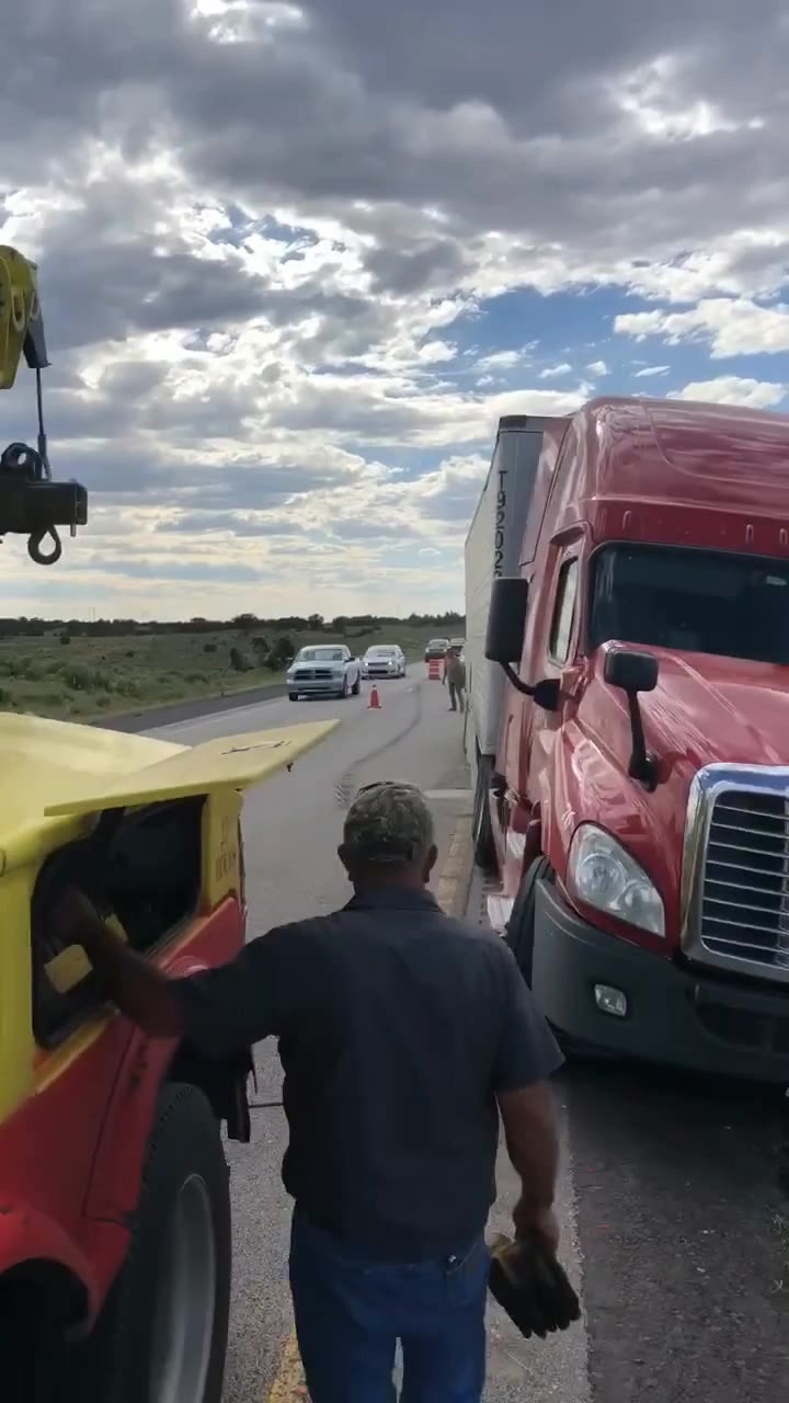 The semi back on its wheels next to an A&A wrecker